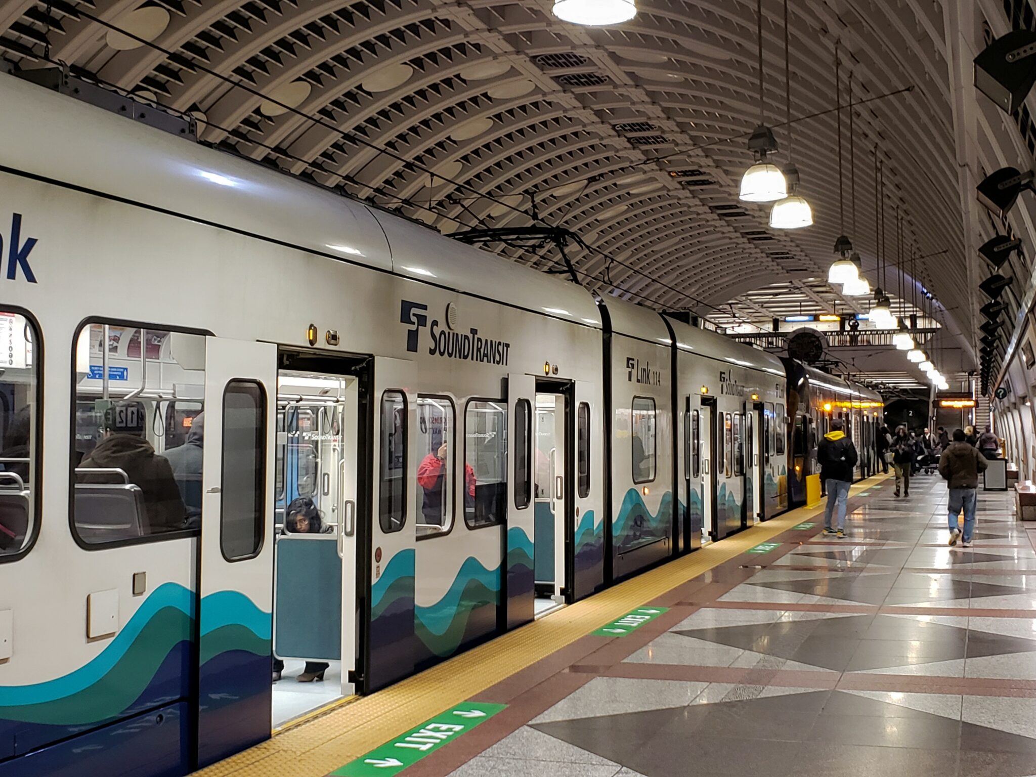 image of light rail with the doors open at a downtown station